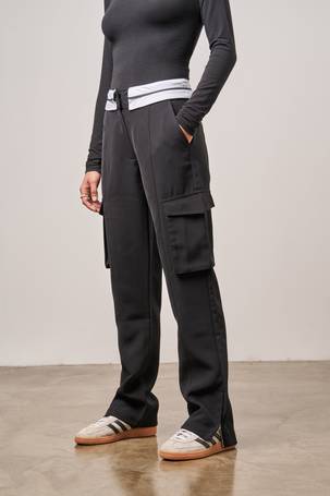 The Couture Club cargo pants in black with multiple pockets and buckle  detail