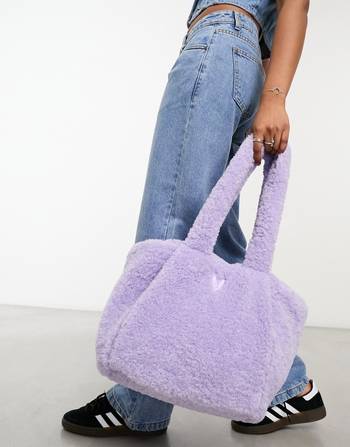 Skinnydip sherpa trimmed tote bag in pastel blue and pink Travel