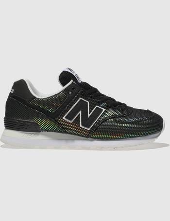 new balance black & gold 574 suede trainers