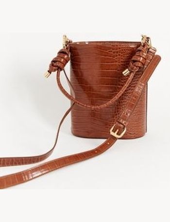 Truffle Collection structured bucket bag with cross body strap in mid tan