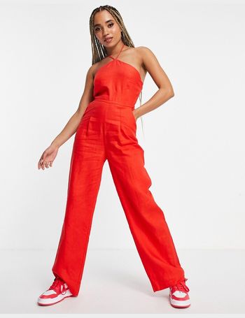 red jumpsuit with skirt overlay