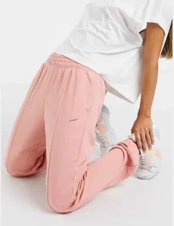 nike mini metallic swoosh oversized joggers in cream