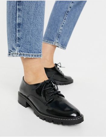 mottle leather flat brogues in black