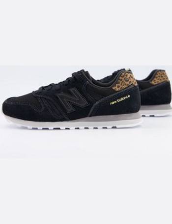 new balance 373 trainers in black and leopard heel