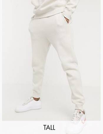 nike tall club cuffed joggers in white